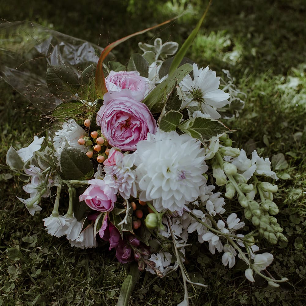 Pink and white wedding bouquet with roses, dahlias and stock for outdoor wedding 