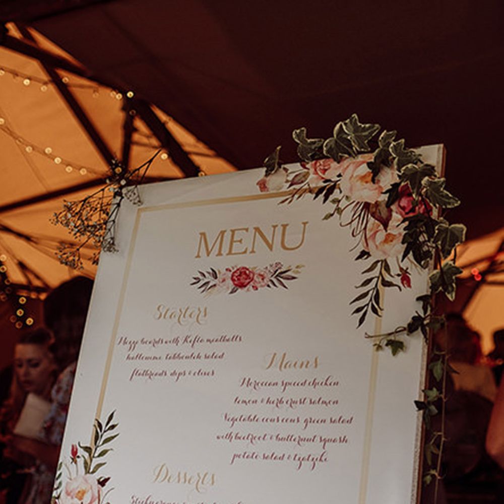 Pink wedding menu sign with pink floral design 