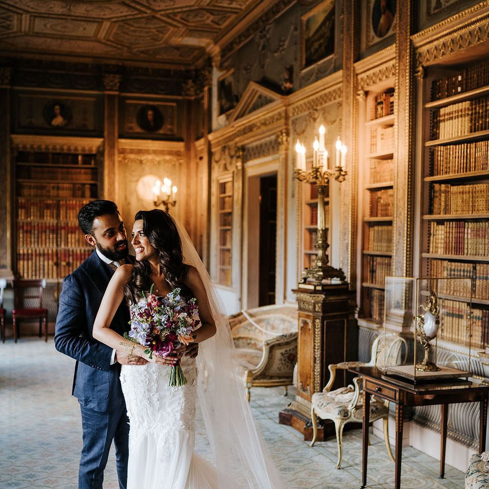 Bride & groom embrace in grand room at Syon Park after first look moment 