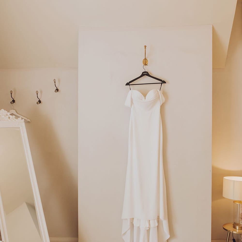 Fitted Vera Wang wedding dress with classic look and off the shoulder styling