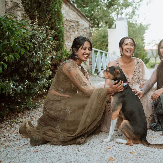 South Asian Bride and bridesmaids with pet dog at Domaine de Blanche Fleur, Provence wedding