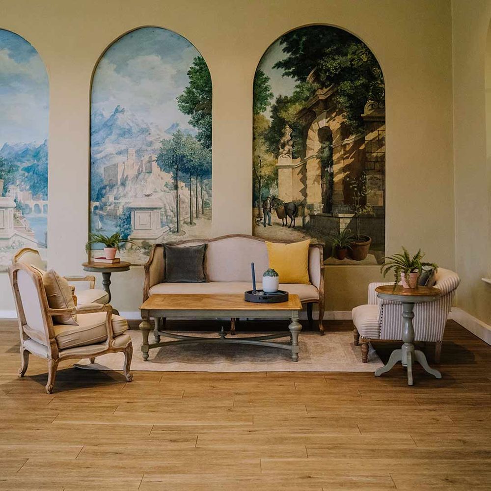 Braxted Park wedding venue reception room with hand painted murals on light yellow wallpaper 