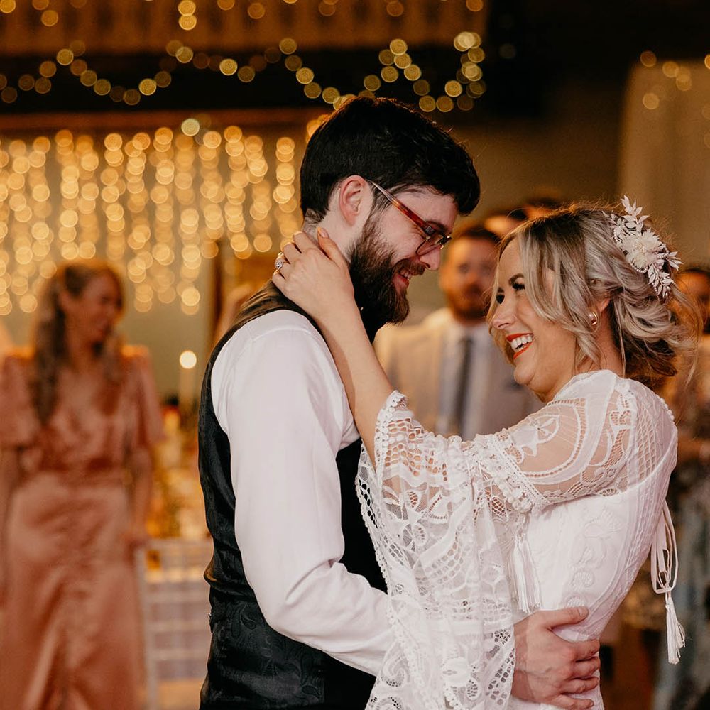The bride and groom share their first dance together as a married couple 