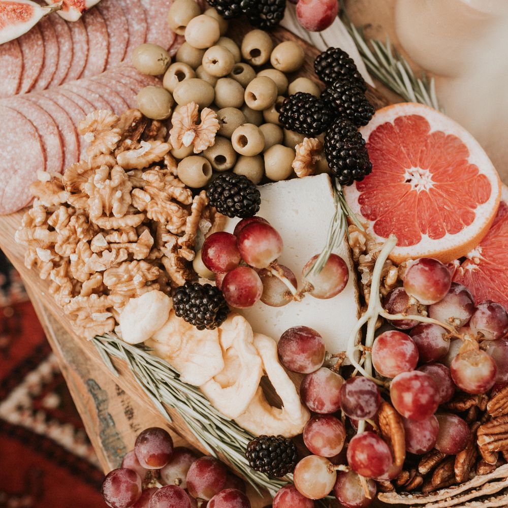 Grazing plate with olives, walnuts and oranges 