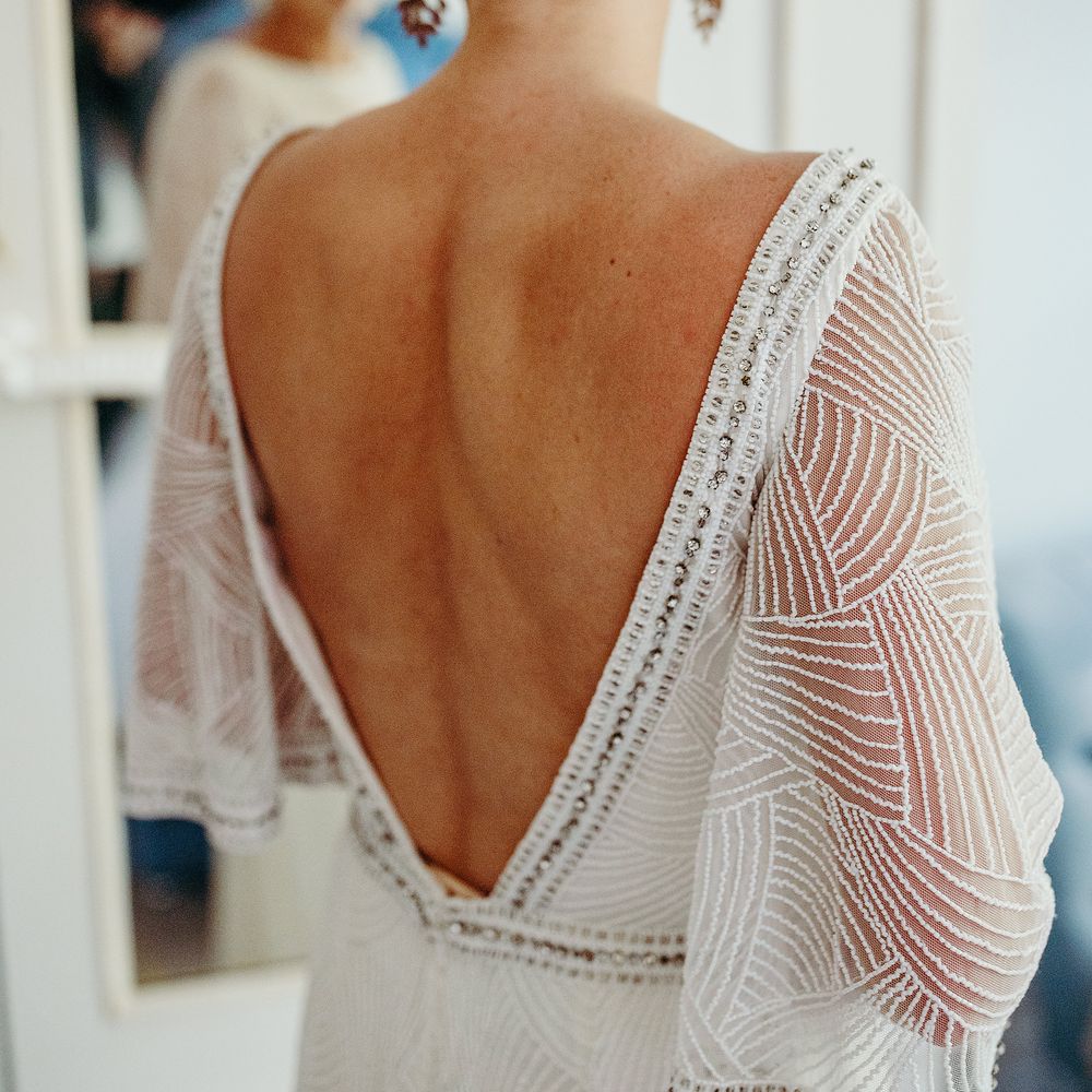 Bride in low back wedding gown 