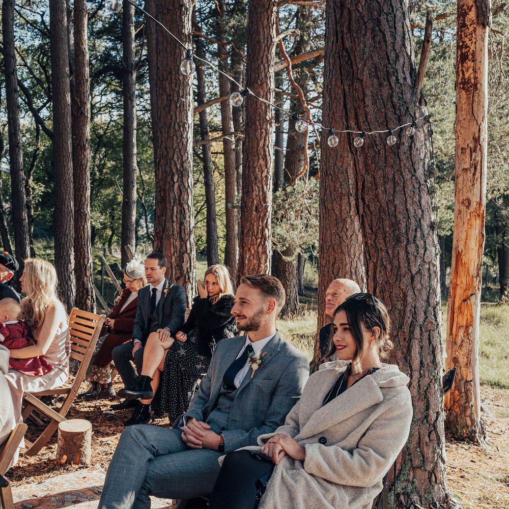 Wedding guests watching during ceremony