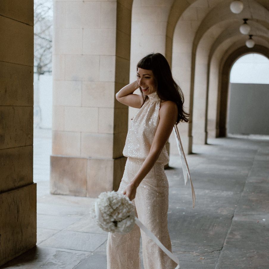 Bride in The Solange Separates with sequin detail, wide leg trousers and halter neck top 