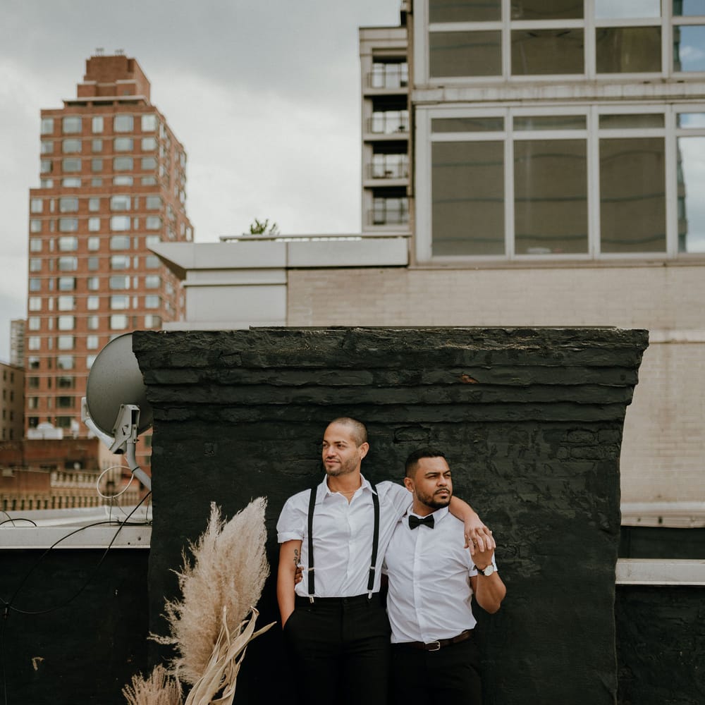 Grooms at gay wedding New York with pampas grass decor