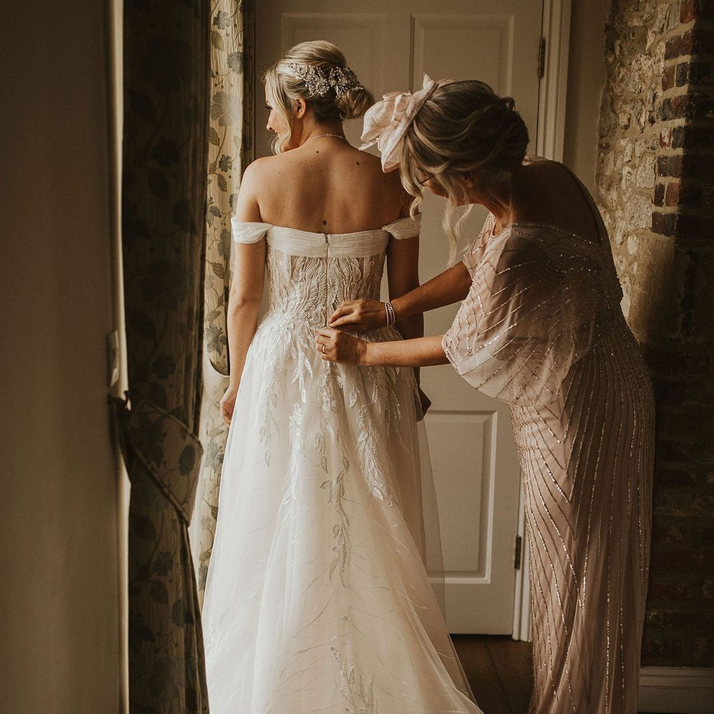 Off the shoulder Pronovias wedding dress with lace detail