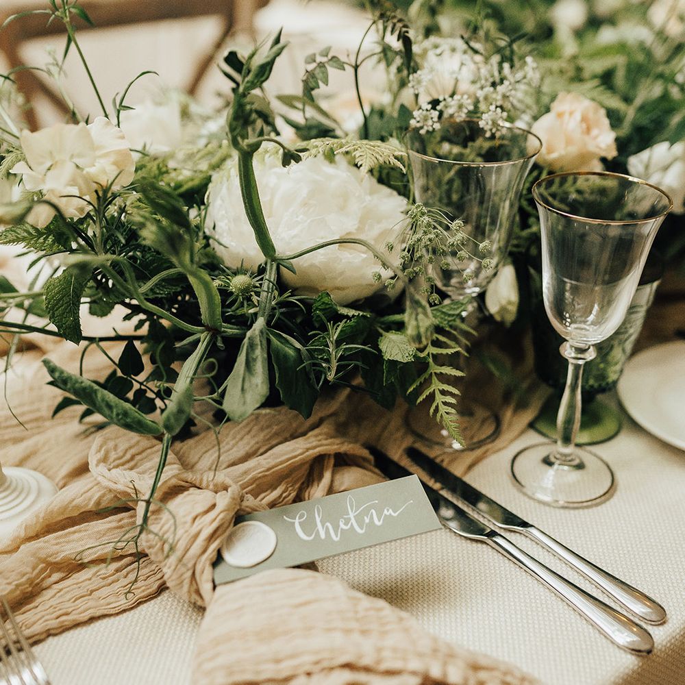 Place setting with linen napkin and name place tag with wax seal 