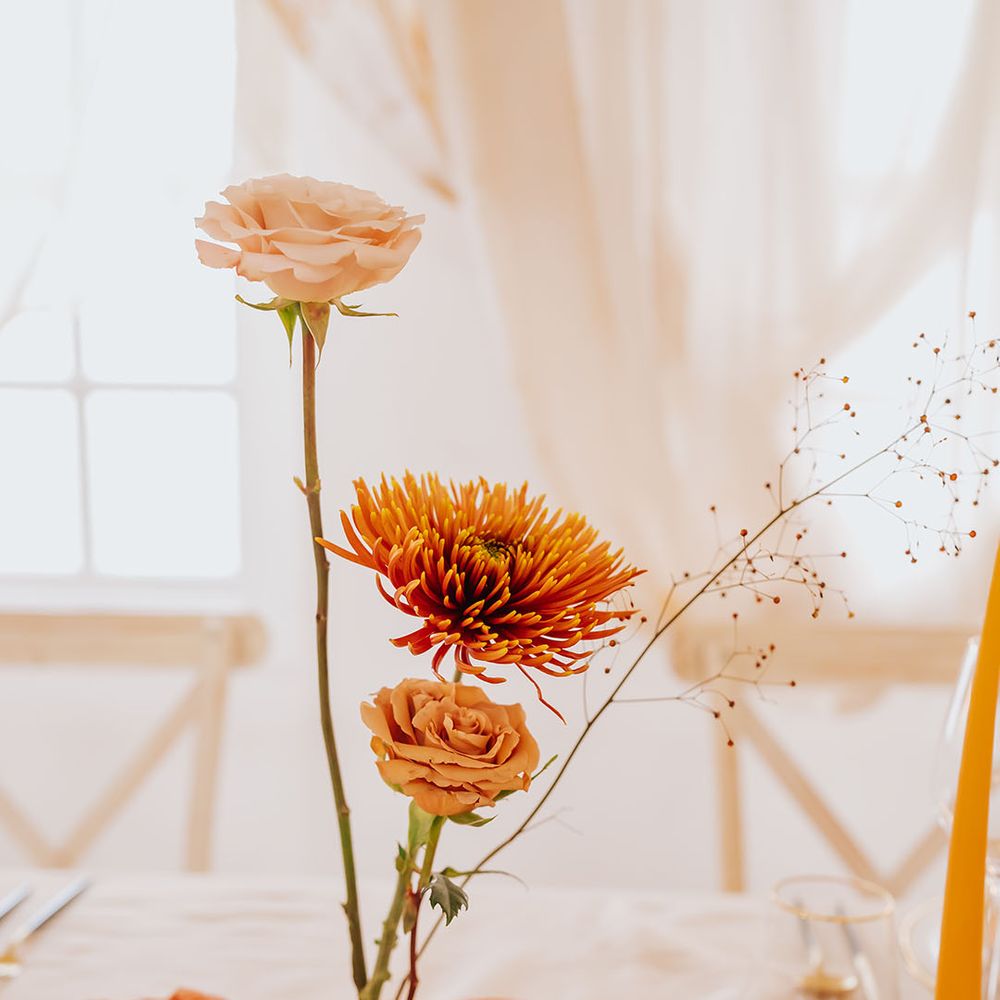 peach and orange wedding flower stems wedding table decor 