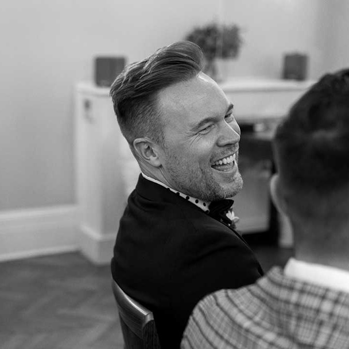 Groom laughs during ceremony at the Chelsea Old Town Hall