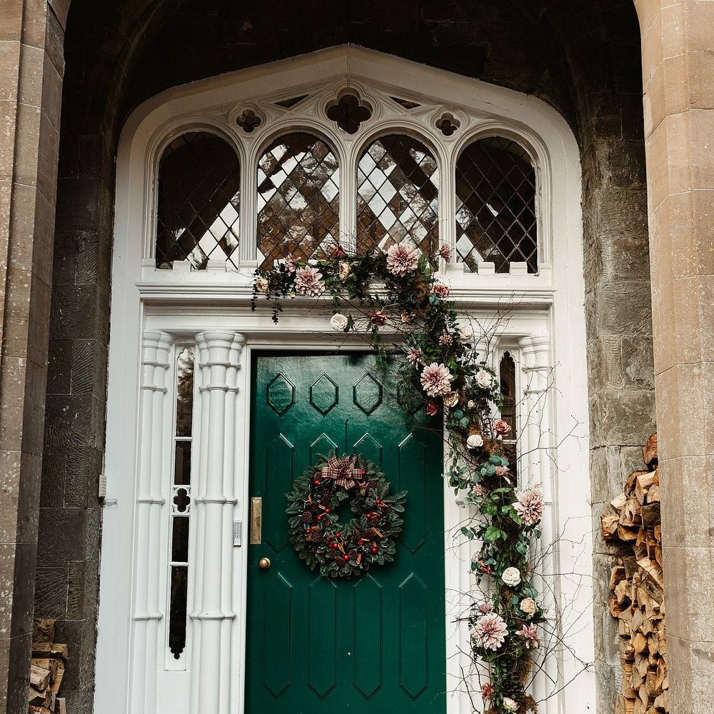 Drumtochy Castle door complete with floral wreath and hanging florals with rustic feel and tartan bow 