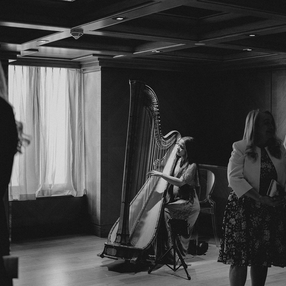 Harpist plays during the wedding ceremony at the Connaught hotel