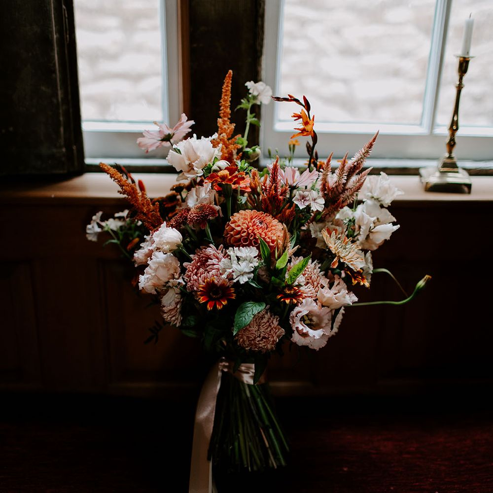 Colourful floral bouquet for boho styled wedding day