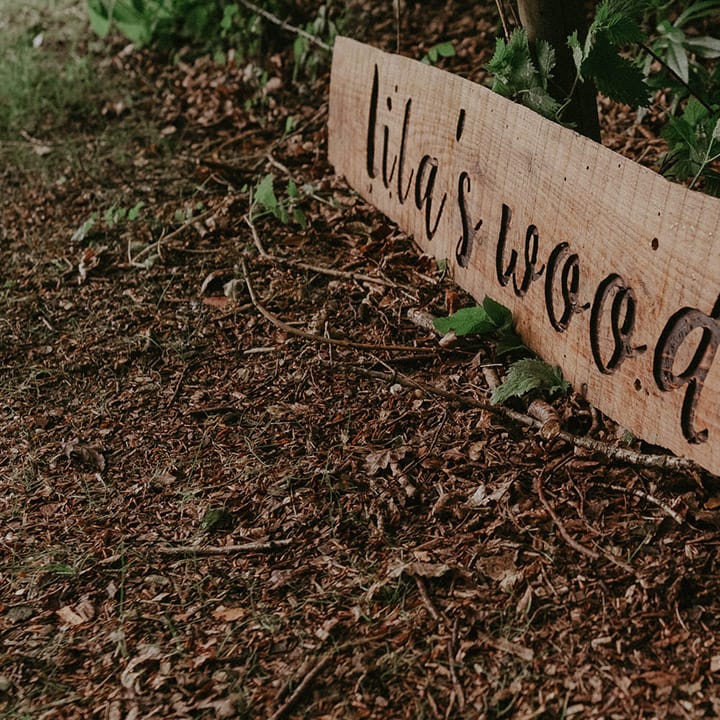 Lila's Wood wedding sign at woodland wedding venue in Hertfordshire 