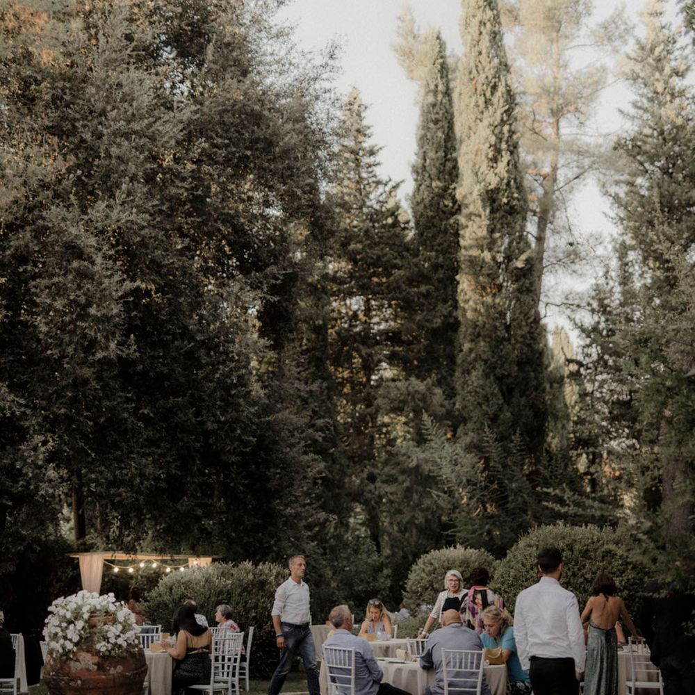 Intimate dinner party wedding with wedding guests seated at Italian wedding 