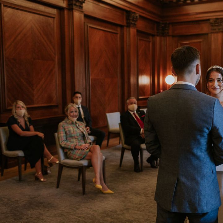 Bride and groom exchanging vows at Old Marylebone Town Hall wedding