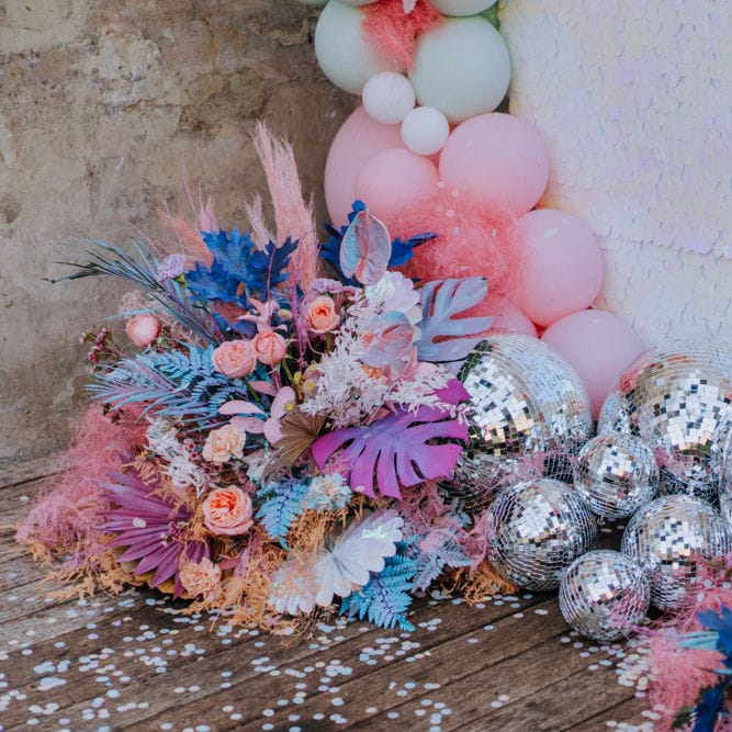 Disco balls and balloons at holographic pastel wedding inspiration
