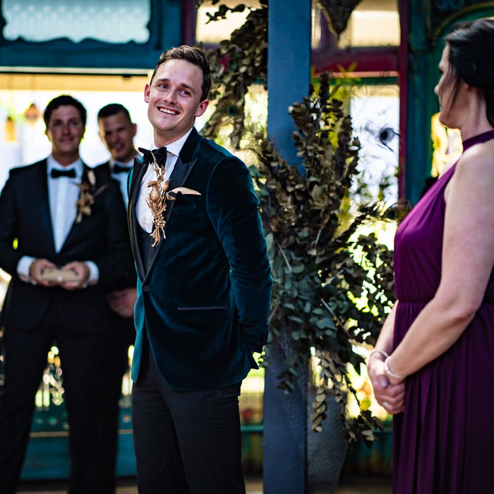 Emotional groom sees bride walking down the aisle