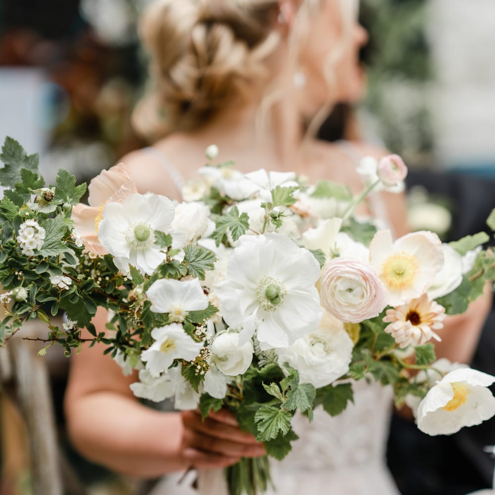 White ranunculus and anemone wedding bouquet 