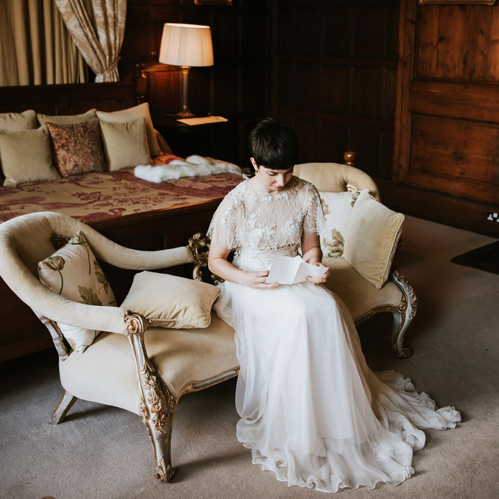 Real bride in an Ana Kara wedding dress with floats skirt and appliqué bodice 