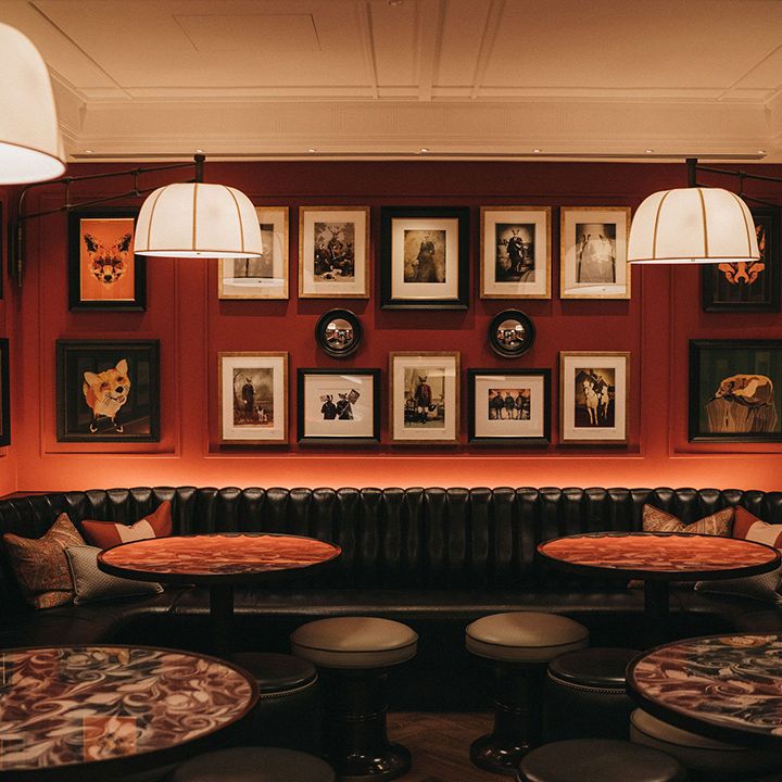 Mayfair Townhouse wedding venue with leather booth seats and gallery picture wall 