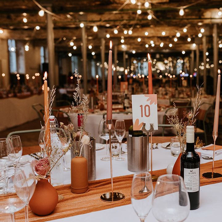 White and orange floral print card with table number for wedding with autumnal theme