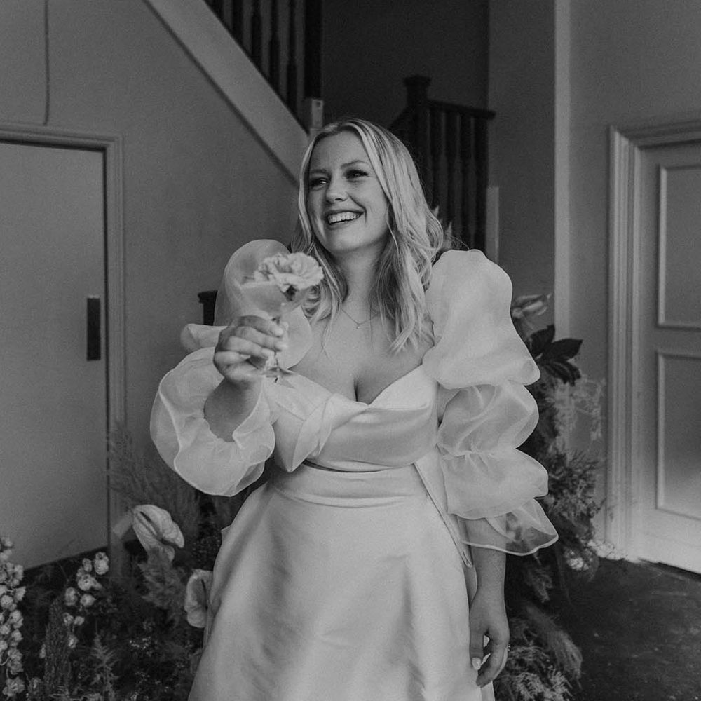 Black and white picture of the bride in a JESUS PEIRO wedding dress