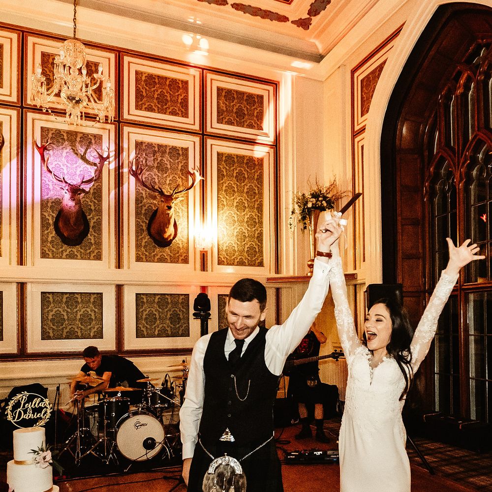 Bride & groom celebrate during first dance at the Drumtochy Castle wedding reception