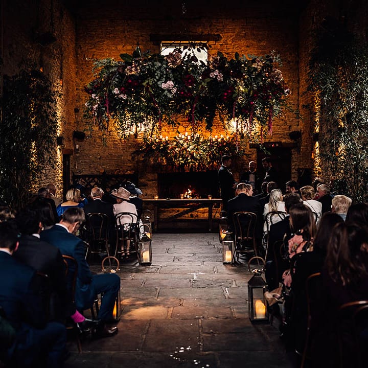 Cripps Barn wedding venue with a rustic theme and guests waiting for the wedding 