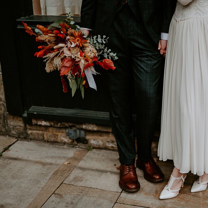 Bride's satin look closed toe heels and groom's brown leather brogues 