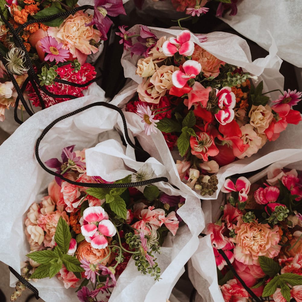 Chrysanthemum, camellias, roses, and peonies make up the colourful and pink wedding bouquets 
