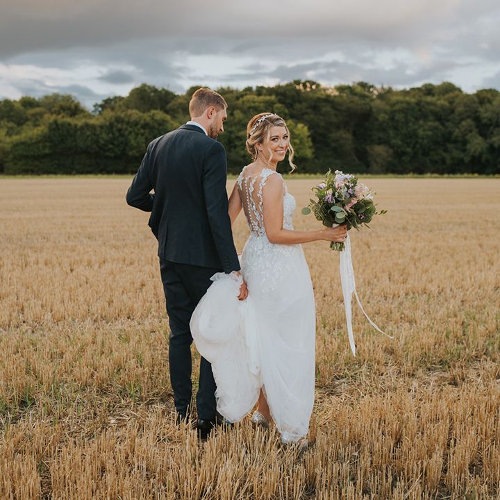 Countryside wedding at Dove Barn in Suffolk with the bride and groom getting their couple portraits out in nature 