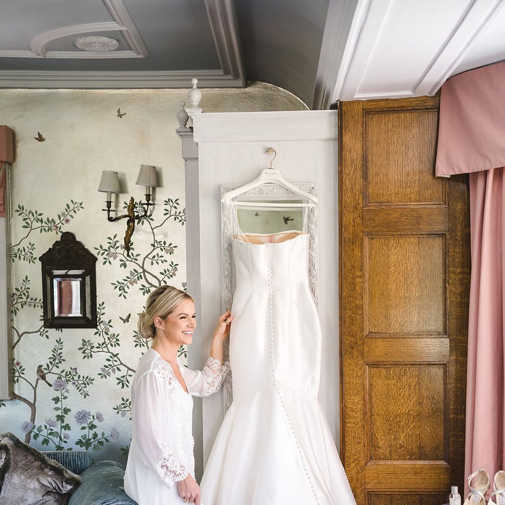 Button back Pronovias mermaid wedding dress for traditional wedding at The Manor House, Castle Combe 