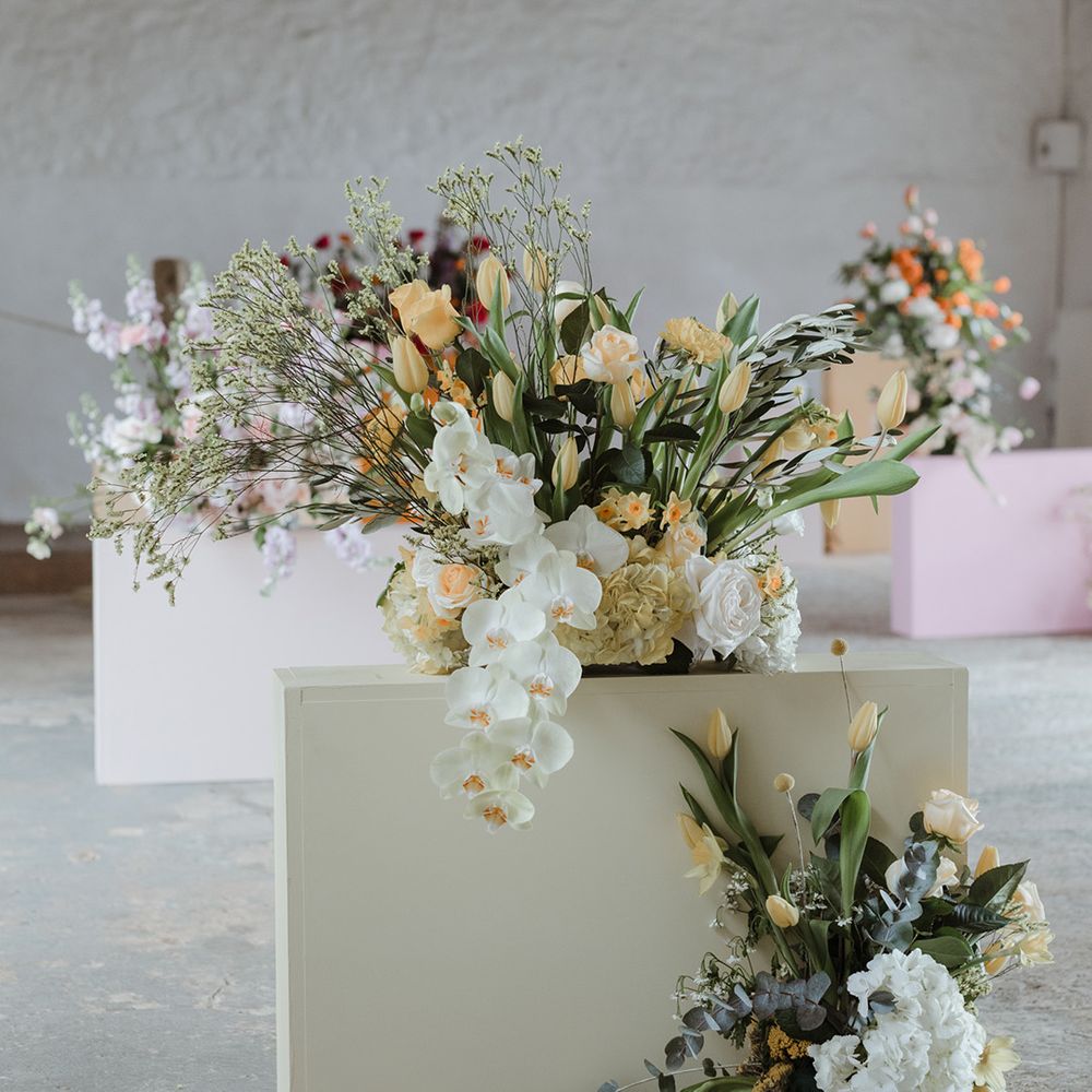 Seasonal spring pastel wedding flowers on the tables at The Cowshed Crail 
