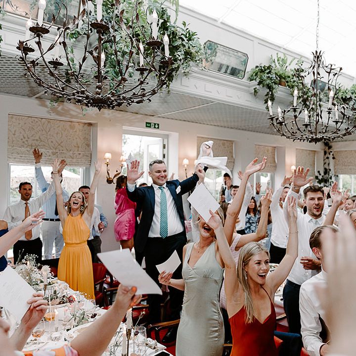 Country House wedding venue with the group of wedding guests celebrating the wedding and having fun 