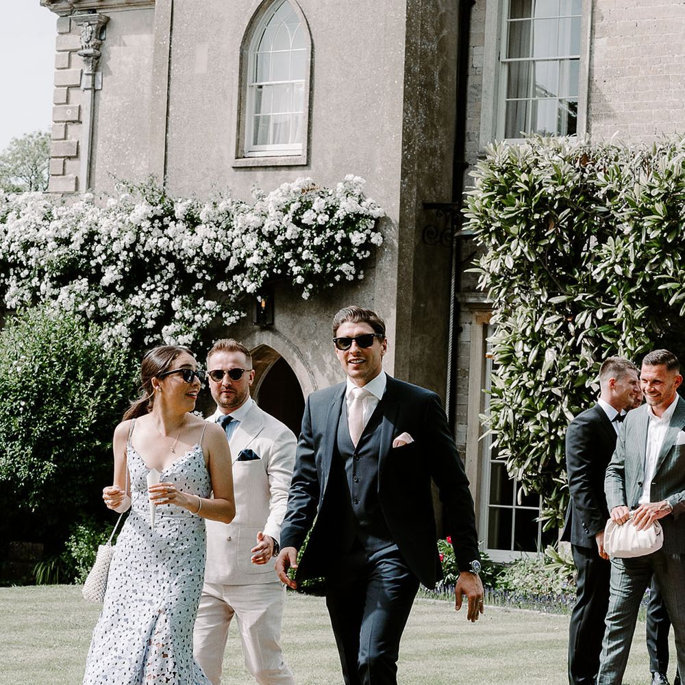 Wedding guests walking around at luxury wedding 