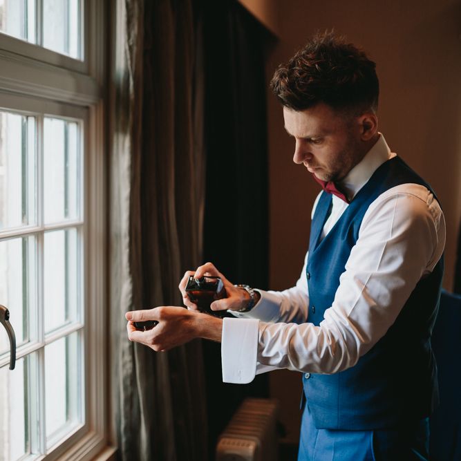 Groom getting ready on the morning of the wedding 