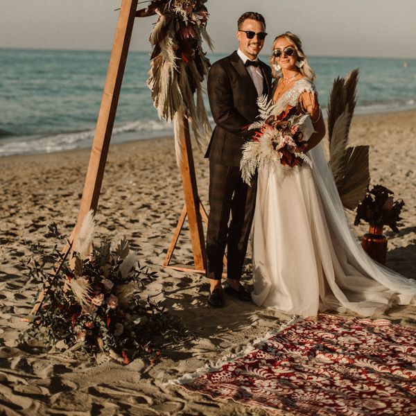Couple in sunglasses after beach wedding in Crete