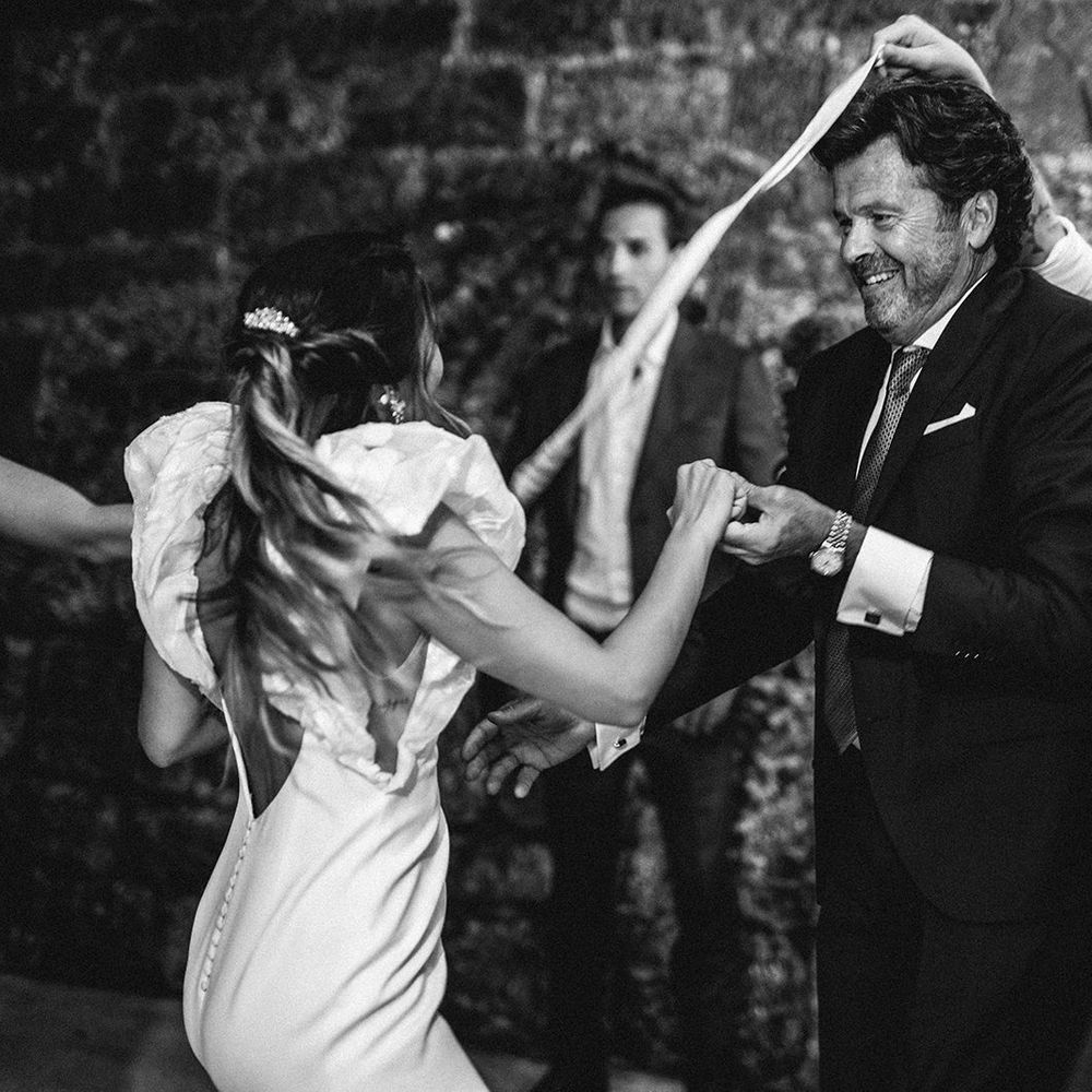 Father of the bride and his daughter dancing at the evening wedding reception 