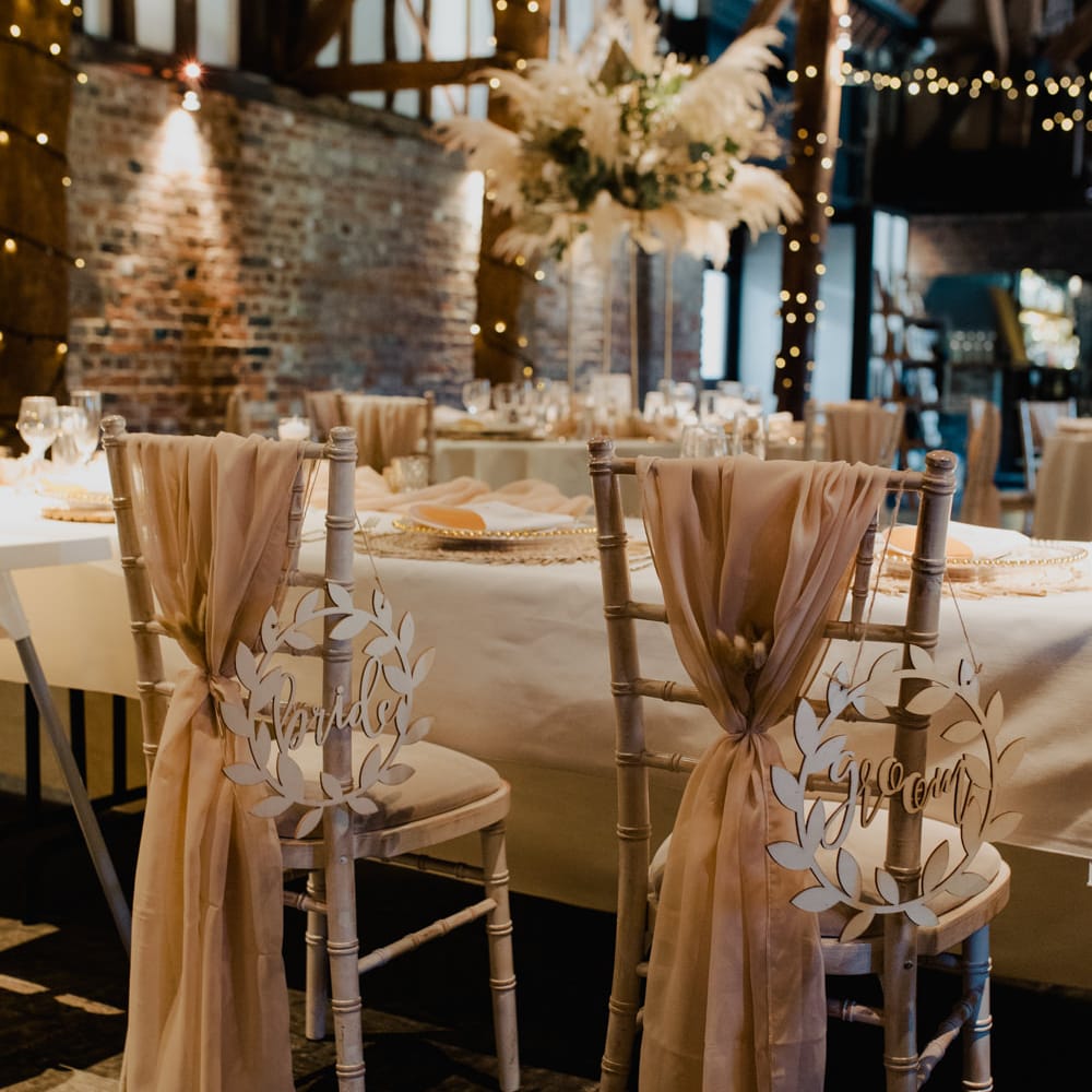 Wooden laser cut bride and groom chair back signs