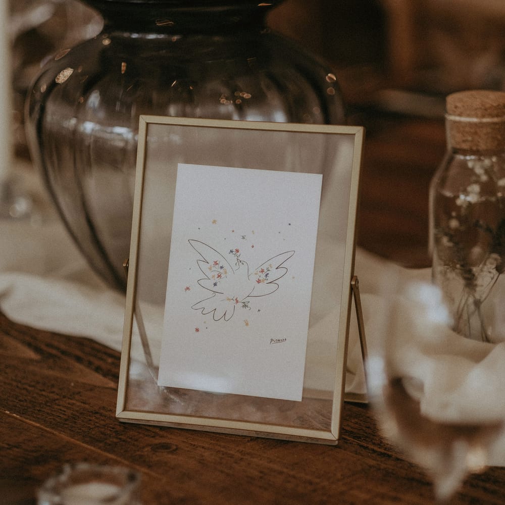Beautiful framed illustrations on wedding tables