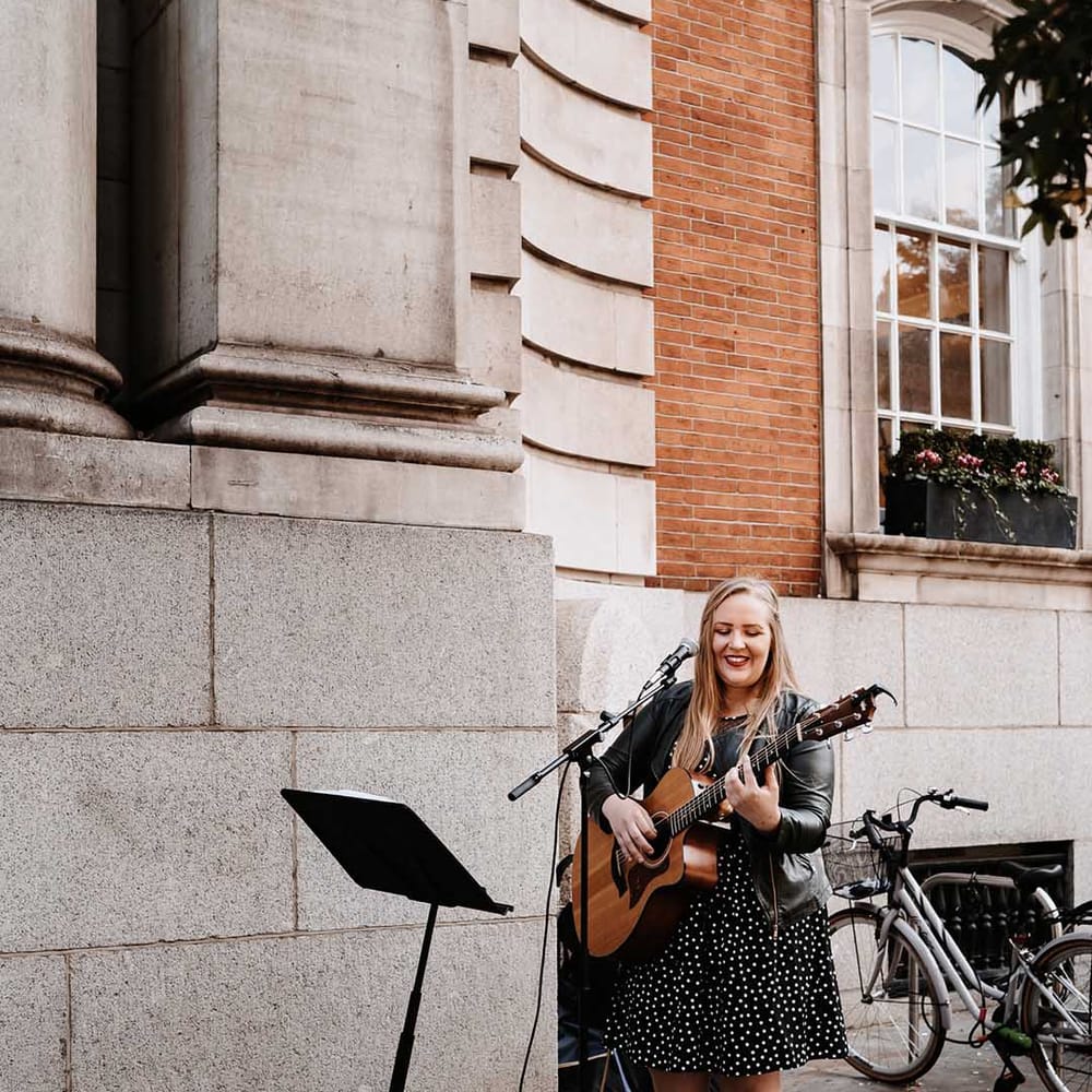 Wedding Guitar player plays outside Town Hall