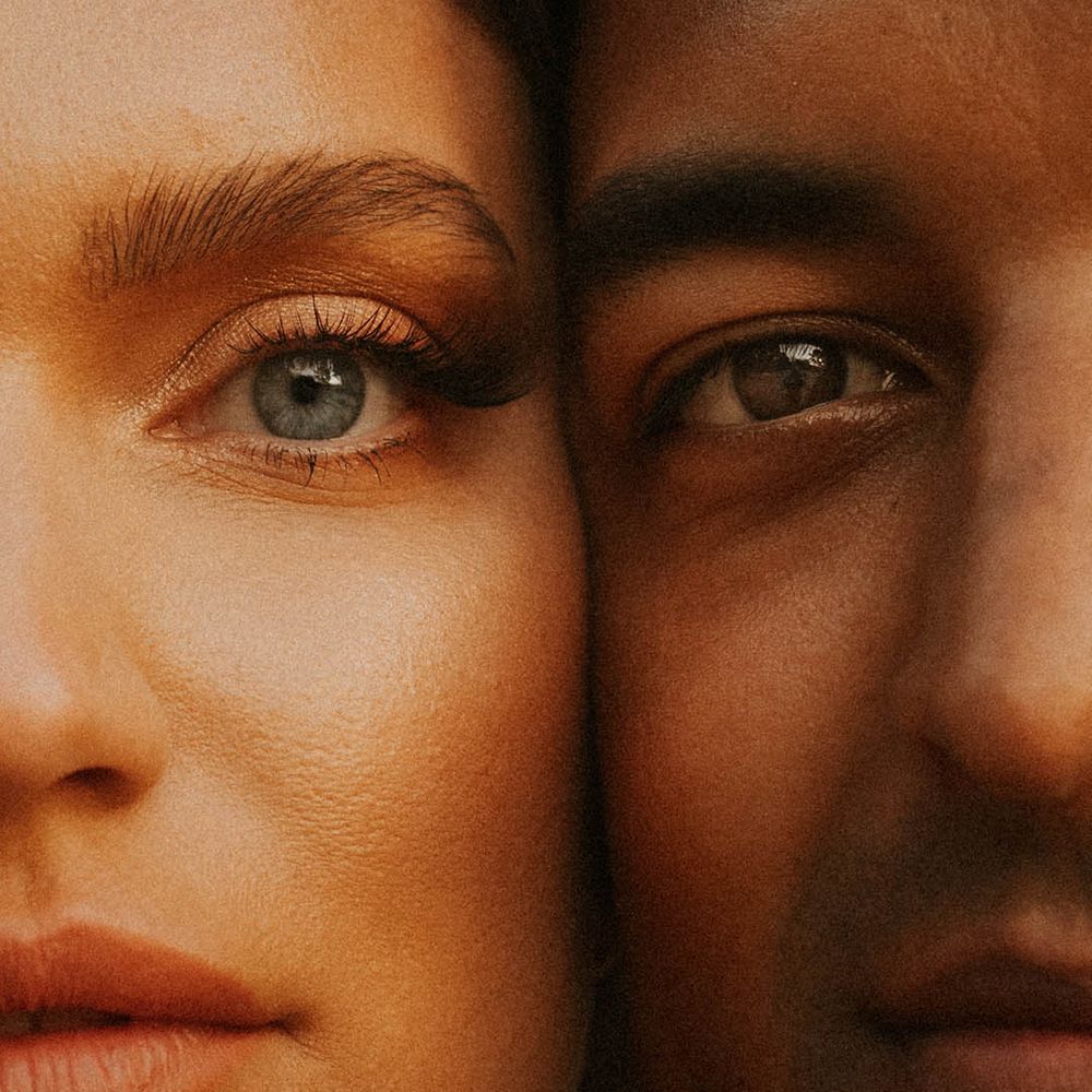Close up image of bride & grooms face on wedding day