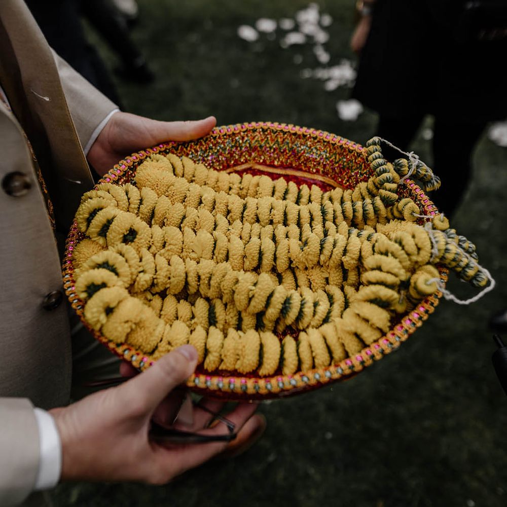 Yellow Milni garlands for multicultural wedding
