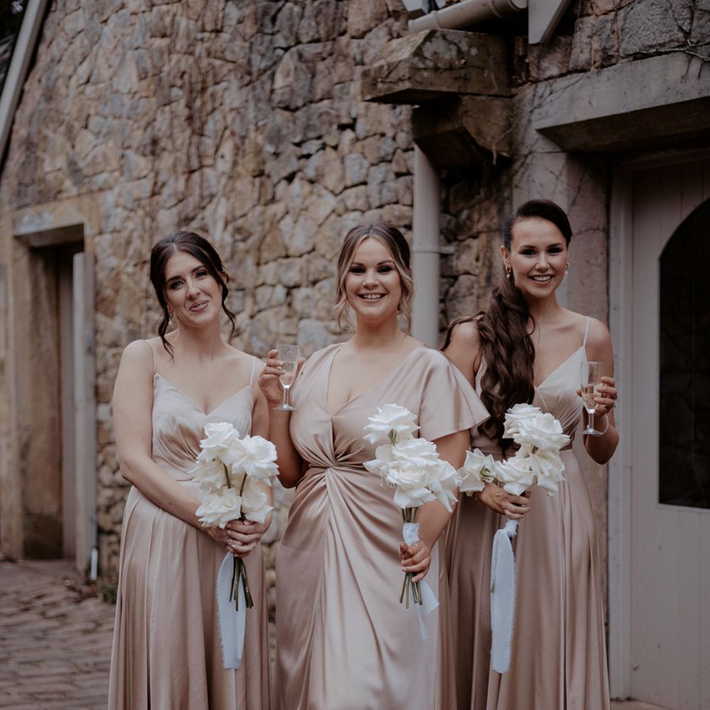 Bridesmaids in satin gold bridesmaid dresses from TH&TH Bridesmaids