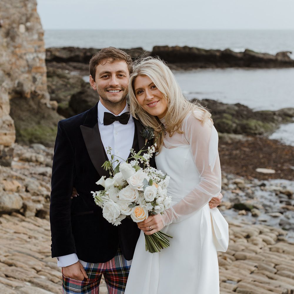 Bride in Jessica Bennett wedding dress with groom in tartan trousers and black tuxedo jacket