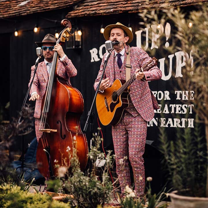 Outdoor wedding band in matching funky suits 