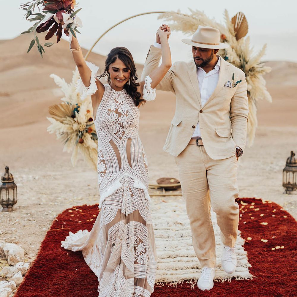 Bride and groom celebrate their wedding ceremony with confetti 